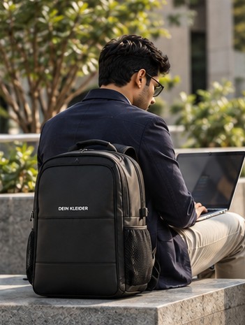 Professional working on a laptop with DEIN KLEIDER backpack